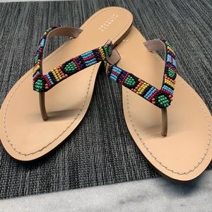 Barney’s New York beaded leather thong